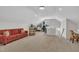 Bright living room featuring an accent sofa, recessed lighting, and lots of space for activities at 2300 Ginger Gold Court, Apex, NC 27539