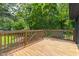 Spacious wooden deck with lush green forest and yard views at 2318 E Main St, Durham, NC 27703