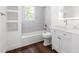 Clean bathroom featuring a tub, shower, and white vanity with great lighting at 2318 E Main St, Durham, NC 27703