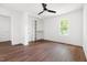 Bright bedroom with hardwood floors, closet, and large window at 2318 E Main St, Durham, NC 27703
