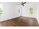 Bright bedroom with hardwood floors and large windows, offering ample natural light at 2318 E Main St, Durham, NC 27703