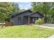Charming single-story home with a well-maintained lawn and inviting front porch at 2318 E Main St, Durham, NC 27703