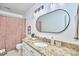 Stylish bathroom with granite countertop, unique mirror, and modern fixtures at 2334 Dawn Trl, Durham, NC 27712