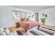 Inviting bedroom with large windows, wood floors, and cozy decor at 2334 Dawn Trl, Durham, NC 27712