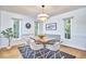 Well-lit dining room with hardwood floors and modern decor at 2334 Dawn Trl, Durham, NC 27712