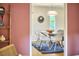 Bright dining room with a wooden table and unique lighting at 2334 Dawn Trl, Durham, NC 27712
