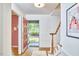 Inviting foyer with wood floors, staircase and view to the front yard at 2334 Dawn Trl, Durham, NC 27712