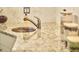 Close-up of granite countertop in kitchen, shows sink and faucet at 2334 Dawn Trl, Durham, NC 27712