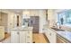 Kitchen with a stainless steel refrigerator, a center island, and custom cabinets at 2334 Dawn Trl, Durham, NC 27712
