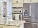 Modern kitchen showcasing stainless steel appliances and a granite countertop island at 2334 Dawn Trl, Durham, NC 27712