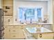 Open kitchen features granite countertops, stainless appliances, and natural light at 2334 Dawn Trl, Durham, NC 27712