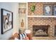 Comfortable living room with brick fireplace and built-in shelves for decor and books at 2334 Dawn Trl, Durham, NC 27712