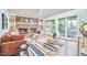 Spacious living room with fireplace, ceiling fan and access to outdoor deck at 2334 Dawn Trl, Durham, NC 27712