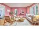 Bright living room with stylish decor, hardwood floors, and large windows at 2334 Dawn Trl, Durham, NC 27712
