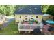 Backyard deck with patio furniture, a grill, and a fenced in grassy yard at 2410 Wade Hampton Rd, Hillsborough, NC 27278