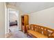 Hallway with a wooden bench and bookcase leading to a bedroom in a home with neutral colors at 2410 Wade Hampton Rd, Hillsborough, NC 27278