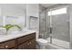 Well-lit bathroom featuring walk-in shower and sleek fixtures at 2769 Cassius Dr, Apex, NC 27502
