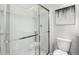 Modern bathroom featuring a glass-enclosed shower, neutral walls, and minimalist decor at 2769 Cassius Dr, Apex, NC 27502