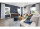 Bright living room with large windows, hardwood floors, and neutral decor at 2769 Cassius Dr, Apex, NC 27502