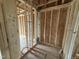 Unfinished bathroom showing 2x4 framing and plumbing connections for the future fixtures at 29 Chloe Ct, Selma, NC 27576