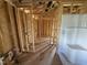 Unfinished bathroom featuring stud walls and a white tub at 29 Chloe Ct, Selma, NC 27576