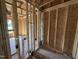 Unfinished bathroom featuring stud walls and plumbing fixtures at 29 Chloe Ct, Selma, NC 27576