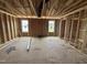 Unfinished bedroom showing the stud framing, exposed ductwork, and an unfinished subfloor at 29 Chloe Ct, Selma, NC 27576