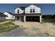 New construction home featuring a two-story layout, covered entrance, and an attached two-car garage at 29 Chloe Ct, Selma, NC 27576