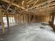 Open-concept living room with exposed beams, a staircase and windows for lots of natural light at 29 Chloe Ct, Selma, NC 27576