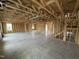 Unfinished living room showing the framing and open floorplan, with light coming in from a window at 29 Chloe Ct, Selma, NC 27576
