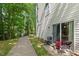 This home features a charming backyard, a small patio, and lush trees for added privacy at 2920 Barrymore St # 106, Raleigh, NC 27603