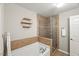 Bathroom featuring a tub, stand up shower, and decorative shelving at 2920 Barrymore St # 106, Raleigh, NC 27603