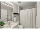Bathroom with a shower and tub combination, tile, and large mirror at 2920 Barrymore St # 106, Raleigh, NC 27603