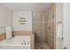 Bathroom featuring a tub, stand up shower, and modern fixtures at 2920 Barrymore St # 106, Raleigh, NC 27603