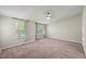 Large bedroom featuring neutral walls, carpet, and an abundance of natural light from two large windows at 2920 Barrymore St # 106, Raleigh, NC 27603