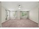 Large bedroom featuring neutral walls, carpet, and an abundance of natural light from three windows at 2920 Barrymore St # 106, Raleigh, NC 27603