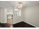Open-concept dining area with hardwood floors and neutral walls adjacent to the kitchen at 2920 Barrymore St # 106, Raleigh, NC 27603