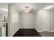 Dining area with dark hardwood floors, neutral walls, and modern lighting at 2920 Barrymore St # 106, Raleigh, NC 27603