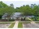 Inviting community building with well-maintained landscaping, a pool area, and accessible parking at 2920 Barrymore St # 106, Raleigh, NC 27603