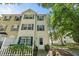 Traditional two-story townhouse featuring green shutters, a white front door, and well-maintained landscaping at 2920 Barrymore St # 106, Raleigh, NC 27603