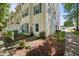 Corner unit townhouse with green shutters and tidy landscaping, on a sunny day at 2920 Barrymore St # 106, Raleigh, NC 27603