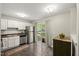 Well-lit kitchen features stainless steel appliances, white cabinets, and a sliding glass door at 2920 Barrymore St # 106, Raleigh, NC 27603