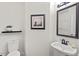 Half bathroom featuring modern fixtures and decor at 3 White Ash Dr, Durham, NC 27712