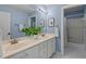 Bathroom offers a double vanity with framed mirrors, tiled floors, and shower/tub combo at 3 White Ash Dr, Durham, NC 27712