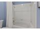 Updated bathroom includes a shower with white tile surround and updated fixtures at 3 White Ash Dr, Durham, NC 27712