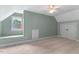 Charming bedroom with a window seat, soft carpet, and a ceiling fan, offers a serene and comfortable space at 3 White Ash Dr, Durham, NC 27712