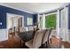 Stylish dining room with hardwood floors, bay window, and elegant blue walls at 3 White Ash Dr, Durham, NC 27712