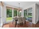 Charming dining area with backyard view and access to the sunroom; great for relaxing and entertaining at 3 White Ash Dr, Durham, NC 27712