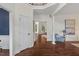 Welcoming foyer with hardwood floors and white trim; leads to other rooms at 3 White Ash Dr, Durham, NC 27712