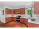 Well-lit kitchen featuring stainless steel appliances, white countertops, and beautiful cabinetry at 3 White Ash Dr, Durham, NC 27712